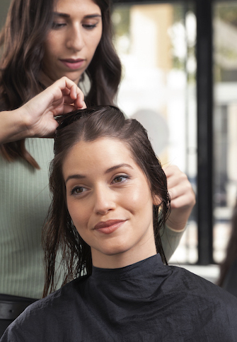 woman getting treatment hairdresser shop 1 2